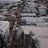 One year after Haiti's earthquake over a million people, 380,000 of them children, still live in crowded camps