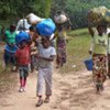 Ivorian refugees, photographed inside Liberia, walking from their village in Côte d'Ivoire with just a few possessions