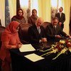 Special Representative of the Secretary-General for Children and Armed Conflict, Radhika Coomaraswamy, signs agreement in Kabul on 30 January 2011.