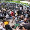 Ivorians injured during a march in December 2010 arrive at UNOCI Headquarters for treatment