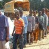 Ivorian refugees in northern Liberia stand in line to receive food rations of cereals, vegetable oil, pulses and corn soya blend