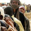 Refugees await food distribution  at the border town of Sallum, Egypt, after fleeing the ongoing crisis in neighbouring Libya