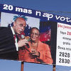 Billboard with candidates Michel Martelly (left) and Mirlande Manigat urging Haitians to vote in the 20 March 2011 election