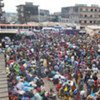 Ivorians congregate at bus station in Abidjan's Adjamé District in bid to flee fighting