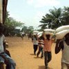 Ivorians collect food at distribution centre in the west of the country