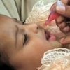 Child being given an oral vaccine