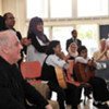 World-renowned conductor Daniel Barenboim (left) with young musicians on his first visit to the Gaza Strip