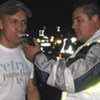 A man blows into a breathalyzer