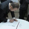 Secretary-General Ban Ki-moon signs the guestbook at the Center for the Promotion of Human Rights, in Buenos Aires, Argentina