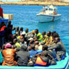 A boat carrying sub-Saharan African migrant workers arrives in Lampedusa from Tripoli, Libya.