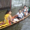 Local transport on the streets of Cotabato City on the Philippine island of Mindanao after heavy rains on 19 June 2011