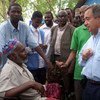 High Commissioner Guterres (right) talks to a disabled refugee leader during a visit in August 2009 to the Hagadera camp, Dadaab