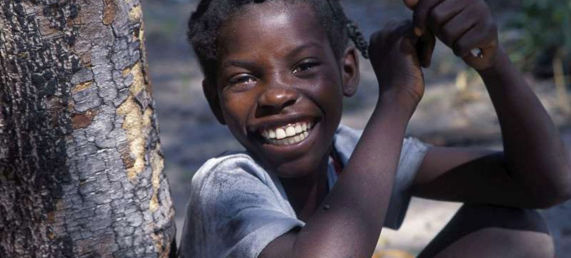 A cheerful young Angolan refugee takes a break from classes in Zambia