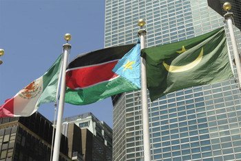 South Sudan’s national flag (centre) flies at UN Headquarters following its admission as the 193rd Member State. UN/E. Schneider
