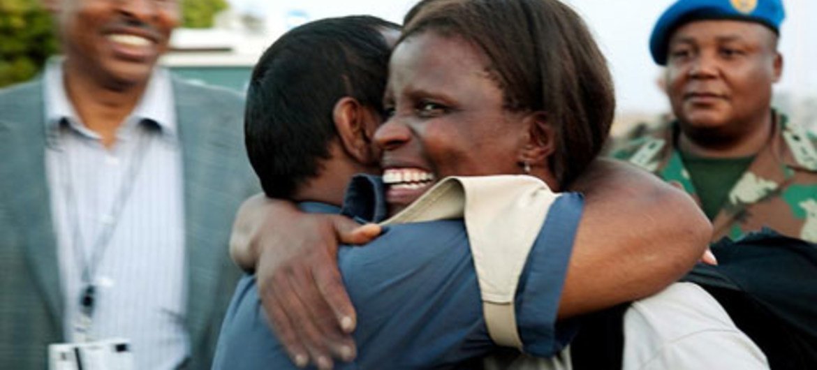 In this April 2010 photo, a UNAMID peacekeeper (front, right) who had been abducted, returns to Nyala, Sudan on her release