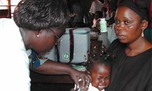 Child being vaccinated against measles