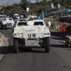UNIFIL armoured vehicles pass through a Lebanese Armed Forces checkpoint near Ghanduriya.