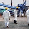 Une équipe de l'AIEA examine les dégâts à la centrale nucléaire de Fukushima Daiichi en mai 2011. Photo : AIEA/Greg Webb.