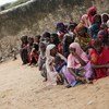 Internally Displaced Somalis wait for food distribution at the Badbado camp