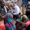 UNHCR chief António Guterres and Sweden's Minister for International Development Cooperation Gunilla Carlsson talk to displaced Somalis in Dollow, south-western Somalia
