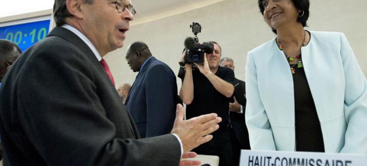 High Commissioner Navi Pillay (right) speaks with Christian Strohal, Vice-President of the Human Rights Council at its 18th session in Geneva