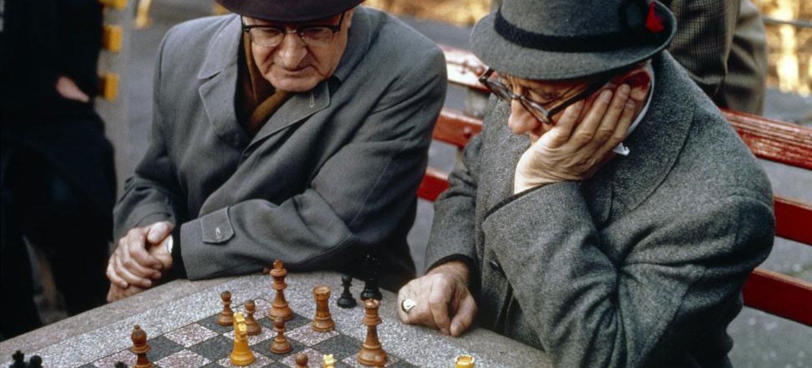 Two chess players enjoying an outdoor game in New York City’s Central Park.