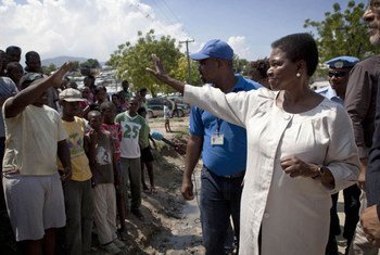 Humanitarian chief Valerie Amos (right) being greeted by residents of the Accra Camp in Haiti during her visit in September 2011