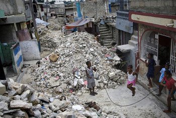 Children jump rope in a rubble-strewn street in the Delmas 32 neighbourhood of Port-au-Prince, Haiti.