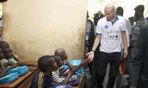 UNDP Goodwill Ambassador Zinédine Zidane (right) meets with students at a school in Bancoumana, Mali