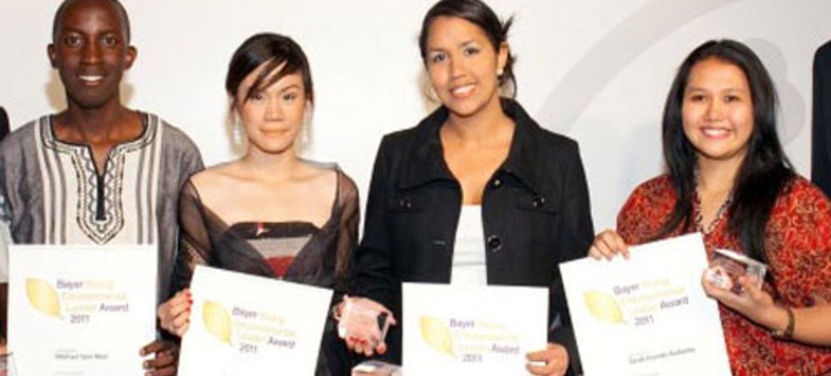The four co-winners of the Young Environmental Leader Award receiving their prizes in Germany