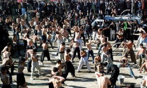 Afghan men perform self-flagellation during the ten-day Shiite mourning period of Ashura