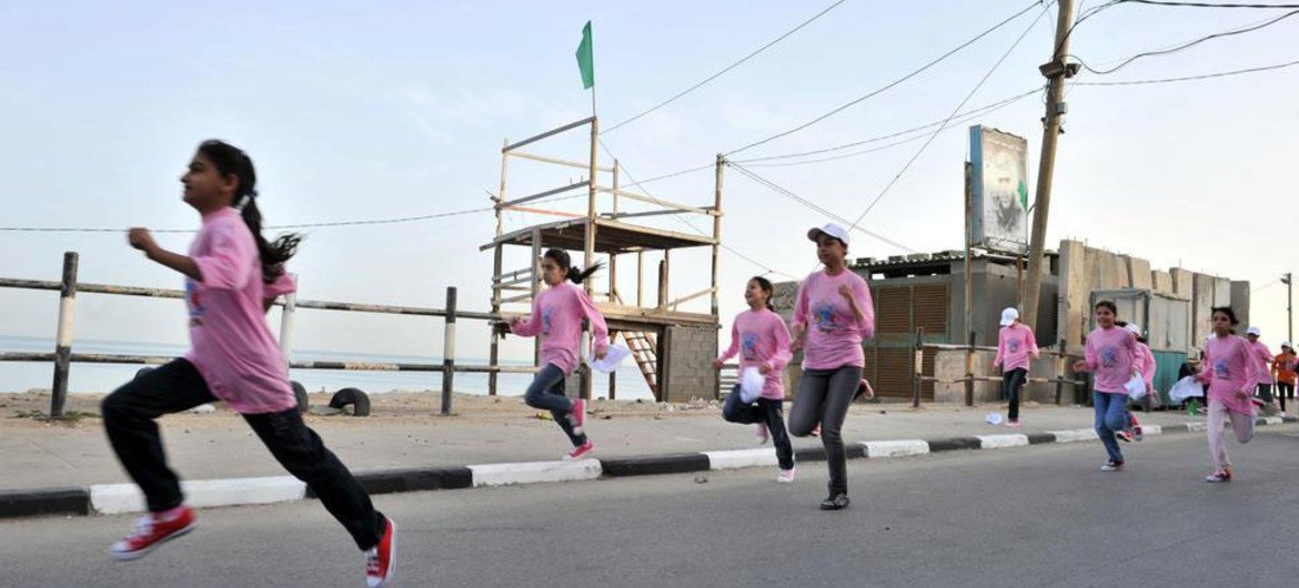 Children run in a marathon organized by UNRWA in the Gaza Strip on 5 May 2011