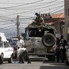 Peacekeepers from UNIFIL’s Italian Battalion patrol the streets of Tyre near the city’s market, 30 Sepetember 2010