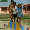 Children in Gantauda, Guinea-Bissau develop their motor skills on the balancing beam.