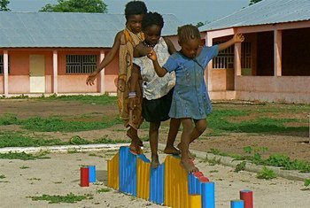 Children in Gantauda, Guinea-Bissau develop their motor skills on the balancing beam.