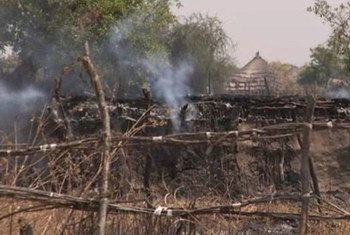 A burning tukul (hut) in Pibor, South Sudan