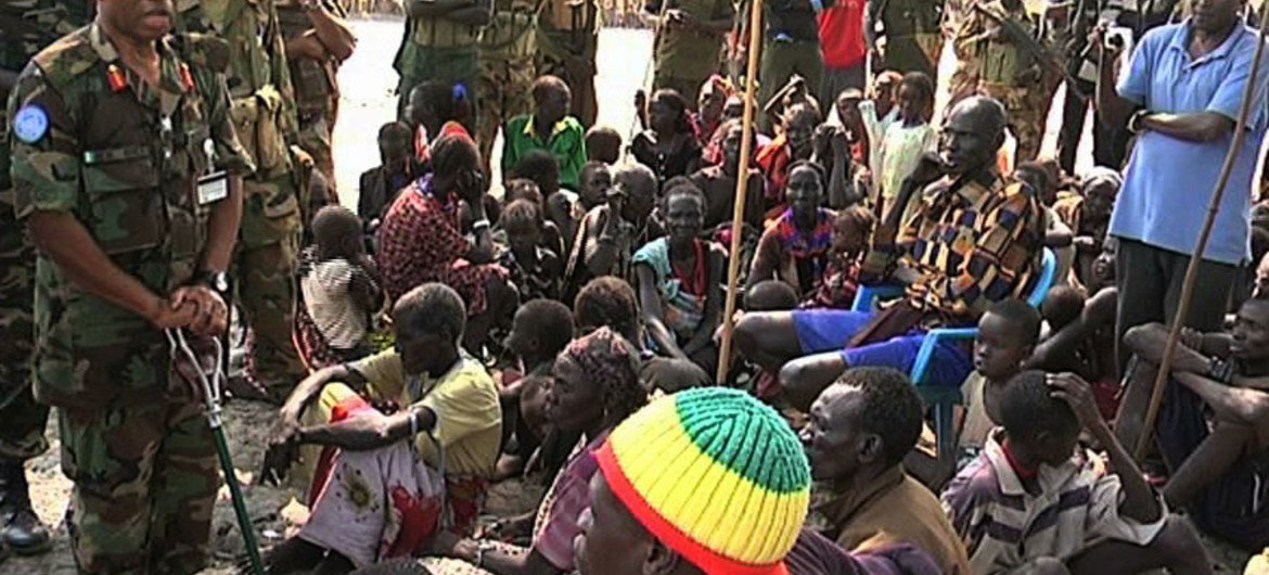 UNMISS Force Commander Moses Obi (left) talking to displaced people in Pibor, South Sudan