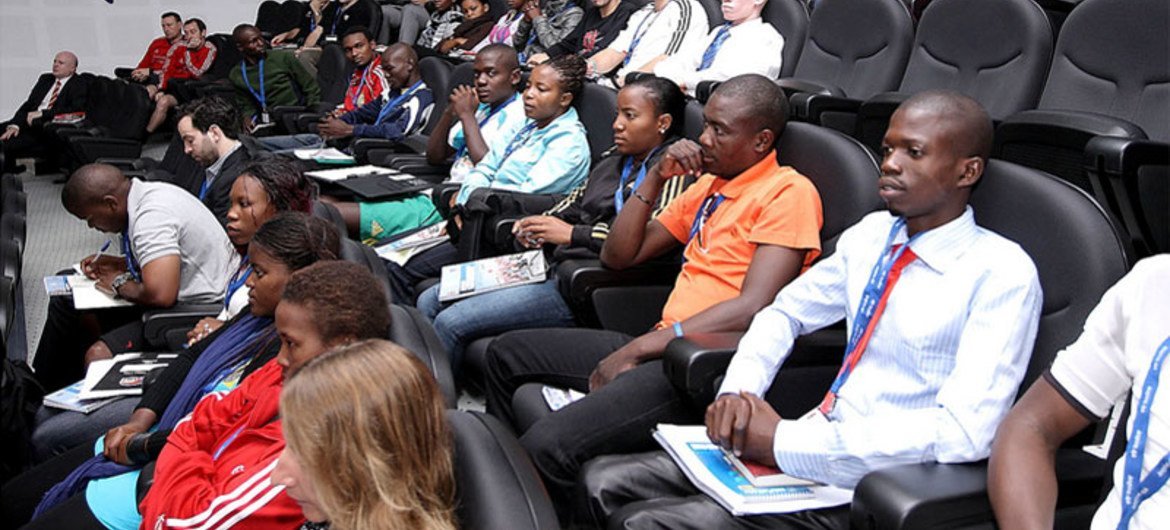 Programme participants attend the opening session in Doha.