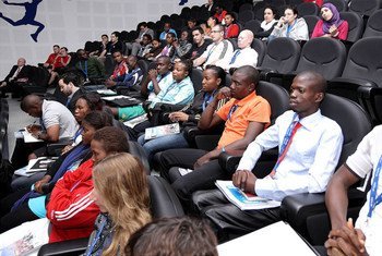 Programme participants attend the opening session in Doha.