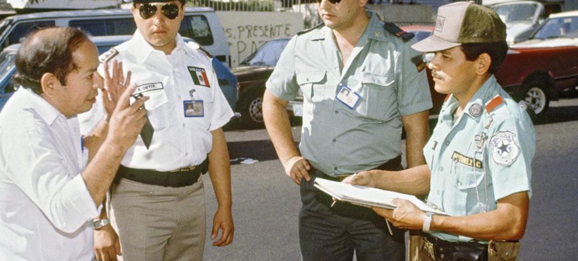 ONUSAL police observing a Salvadoran police officer (right) making a traffic stop, 1 February 1992.