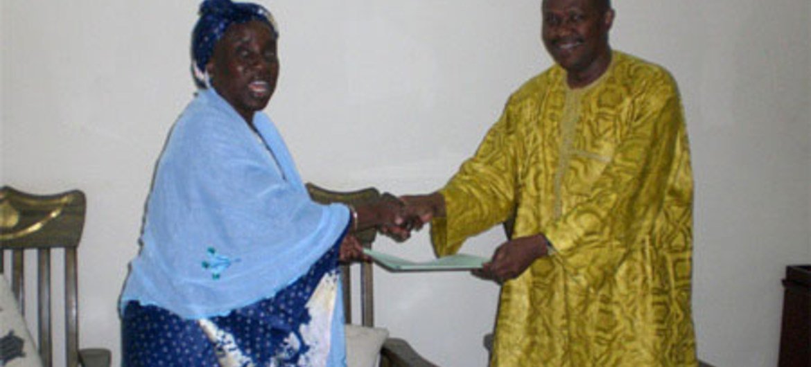 Judge Fatoumata Dembele Diarra, of the International Criminal Court (left) after signing agreement with Foreign Minister Soumeylou Boubeye Maiga of Mali.