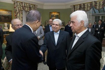Secretary-General Ban Ki-moon (back to camera) greets Greek and Turkish Cypriot leaders Demetris Christofias (centre) and Dervis Eroglu (right) at Greentree Estate in Manhasset, New York.