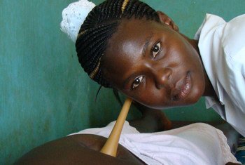 A midwife attending to an expectant mother in a health centre in northern Uganda.