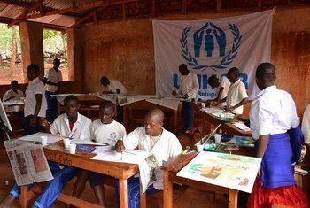 Congolese refugees and local Tanzanian children learn about art techniques side by side.