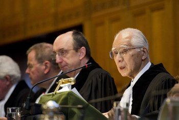 President of the International Court of Justice Hisashi Owada (right), reads out the Court's Judgment in the case between Germany and Italy.