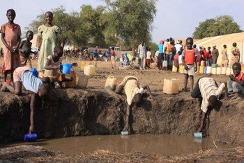 Young refugees from Sudan's Blue Nile state collect water to wash with at Doro camp in South Sudan.