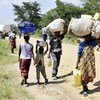 Des personnes fuyants la province du Nord-Kivu en RDC pour se réfugier en Ouganda.