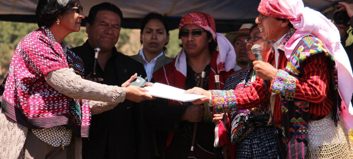 UN human rights chief Navi Pillay receiving petitions from indigenous authorities at a meeting in Guatemala.