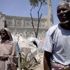 Somali civilians on the grounds of a ruined cathedral in Mogadishu in August 2011.