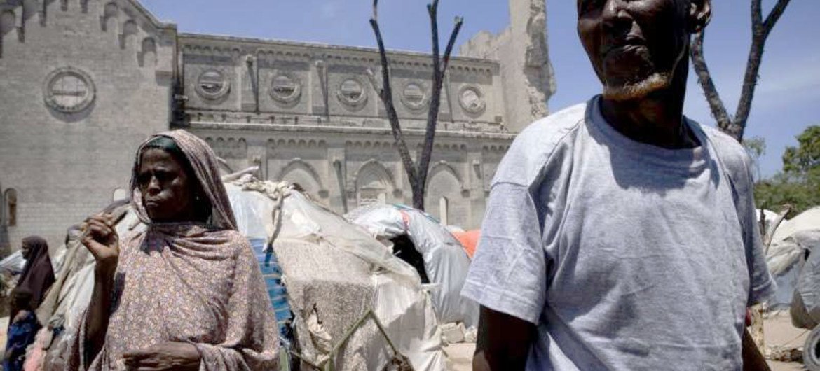 Somali civilians on the grounds of a ruined cathedral in Mogadishu in August 2011.